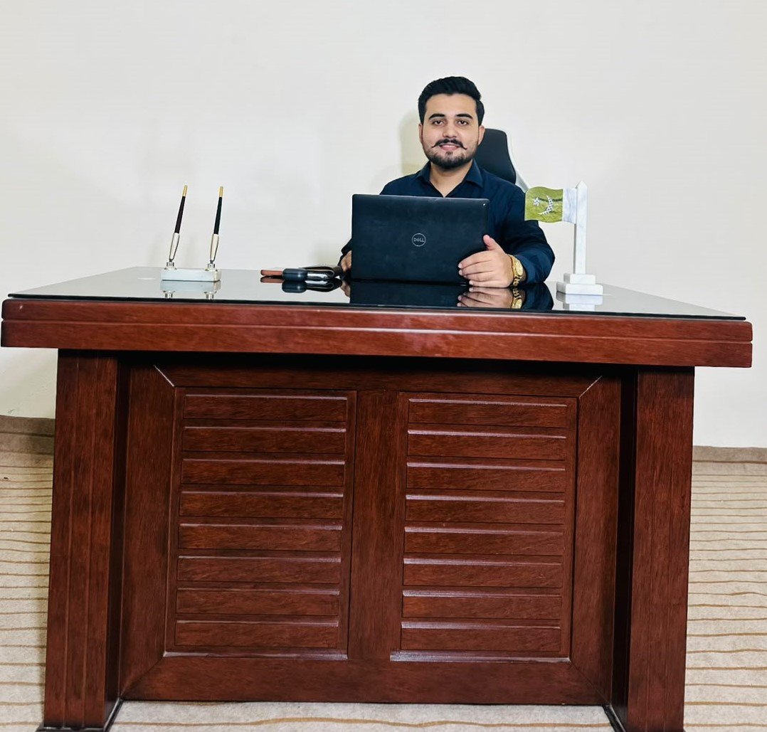 Ali Hasnain, founder of TechXsolve, at his office desk